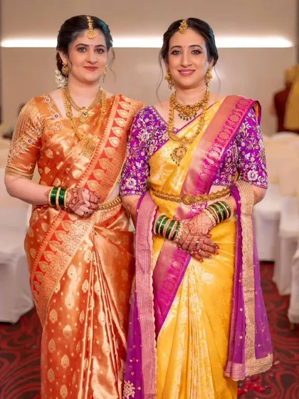 A beautiful moment between the bride and her sister, both draped in gorgeous South Indian silk sarees. I ensured their drapes were coordinated yet unique to their individual styles.