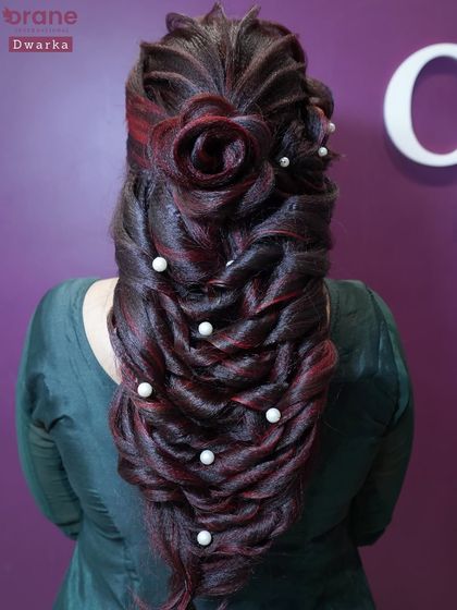 A beautiful mermaid braid with a rose detail, combining different techniques for a stunning fantasy hairstyle.