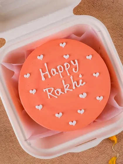 Our Rakhi bento cakes are perfect for a personal gift. This orange cake with a "Happy Rakhi" message is a sweet and simple way to celebrate.