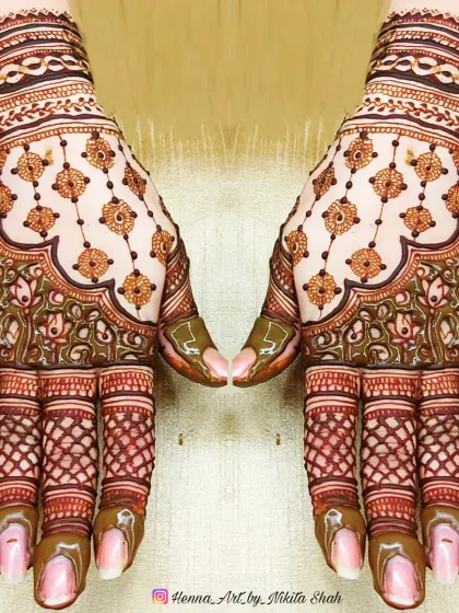 A beautiful designer back-hand mehendi. The hanging motifs and delicate net pattern create a very graceful and stylish look.