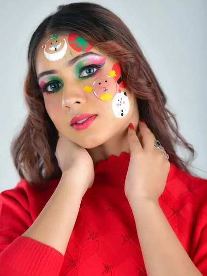 This angle shows the placement of the cute Christmas characters on the forehead and cheek. The look is playful yet polished, perfect for a holiday party or themed content.