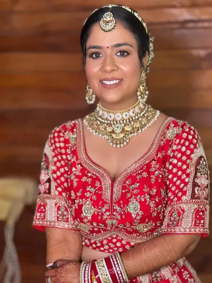 Khushi's complete bridal look. The makeup enhances her features beautifully, creating a look that is both traditional and stunning.