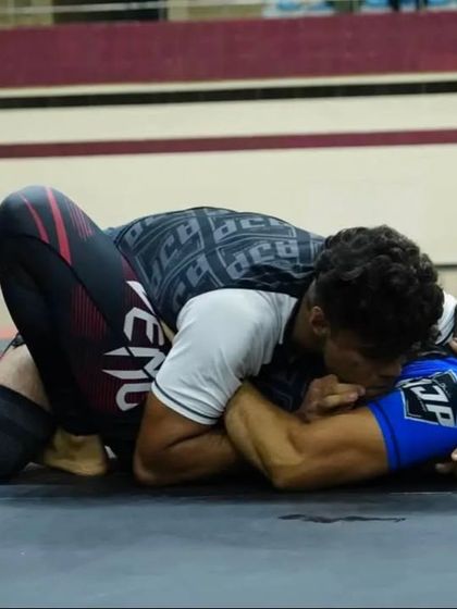 This is what control looks like in a grappling match. Applying shoulder pressure from side control to exhaust the opponent and open up opportunities for submissions.