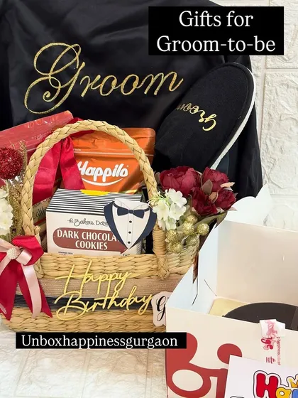 Celebrating the groom-to-be with a custom birthday hamper. This gift includes a personalized 'Groom' robe, matching slippers, his favorite snacks, and a birthday cake, making it a perfect gift for a double celebration.