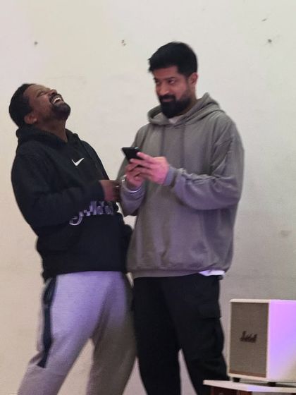 Sharing a laugh with a friend during a class break. The creative process is intense, but it's always filled with fun and lighthearted moments.