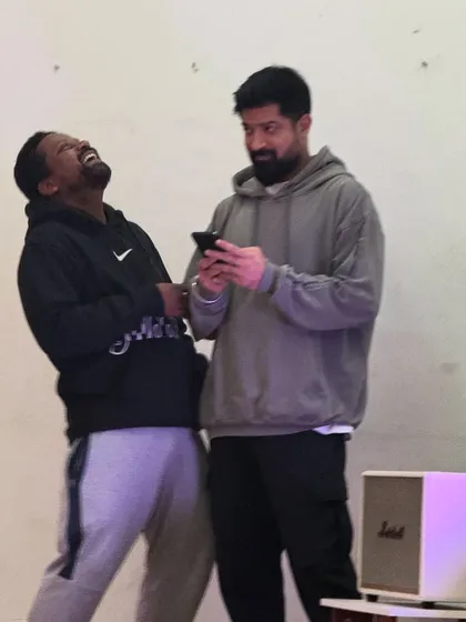 Sharing a laugh with a friend during a class break. The creative process is intense, but it's always filled with fun and lighthearted moments.