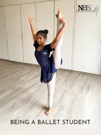 A student demonstrates a beautiful standing split. This level of flexibility and control is the result of consistent practice and dedicated training.