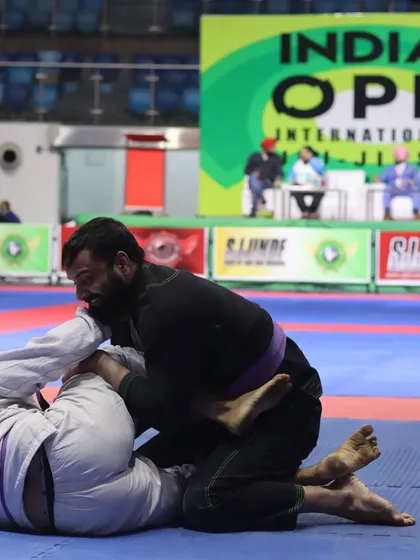 In the middle of a tough exchange during a Jiu-Jitsu tournament. This is where your conditioning and technique are truly tested.