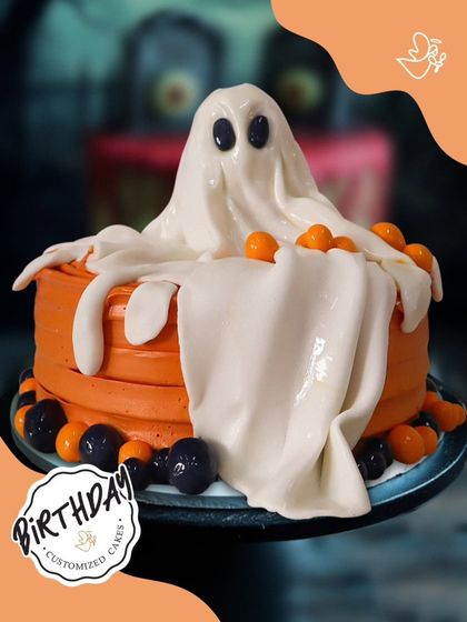 A spooky and fun ghost-themed cake. This creative design is perfect for a Halloween birthday or for someone who loves a little bit of frightful fun.