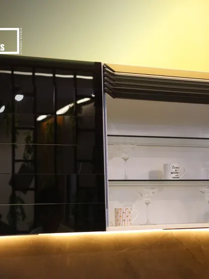 This lift-up cabinet features both glossy black and metallic finishes, demonstrating how we combine different materials for a unique, modern look.