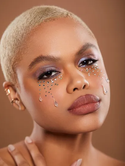 An ethereal and emotional look with glitter "tears" falling from the model's eyes. This is storytelling through makeup.