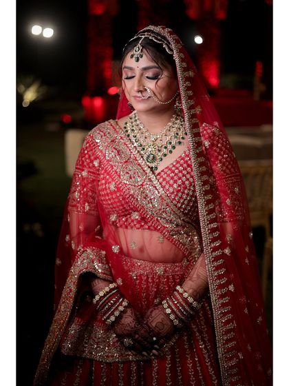 A serene portrait of the bride. The soft focus on her eyes shows the detailed work, while her skin remains fresh and natural.