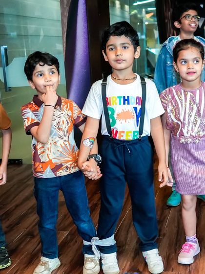 The birthday boy and his friends showing off their temporary tattoos, a fun and popular activity at my creative parties.