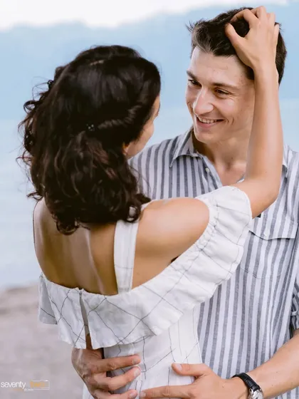 The way he looks at her. A simple, candid moment filled with affection and joy, captured by the water in Switzerland. This is what real love looks like.