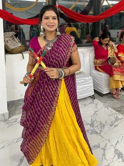 Embracing the spirit of Navratri. I love dressing up for festivals, and holding the dandiya sticks just gets me in the mood to dance Garba all night.