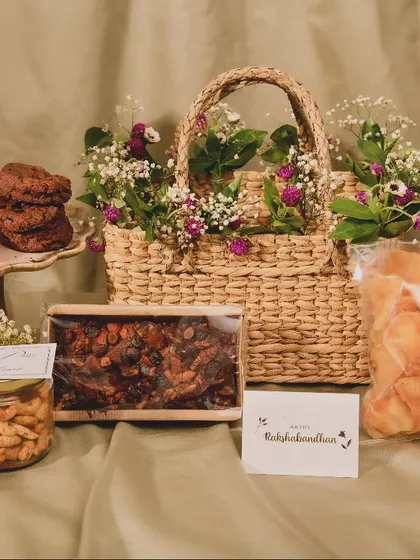 My Rakhi Hamper is a perfect balance of sweet and savory. This beautiful basket is curated with love and includes treats like truffle chips, assorted cookies, and flavored nuts to make your siblings feel special.