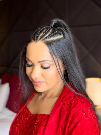 A close-up of the intricate braids in this modern half-updo.