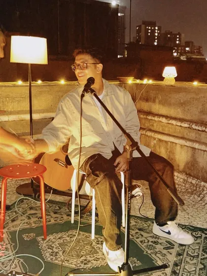 Sharing a laugh on stage during an intimate rooftop gig. These smaller shows allow for a lot of personal interaction with the audience and other performers.