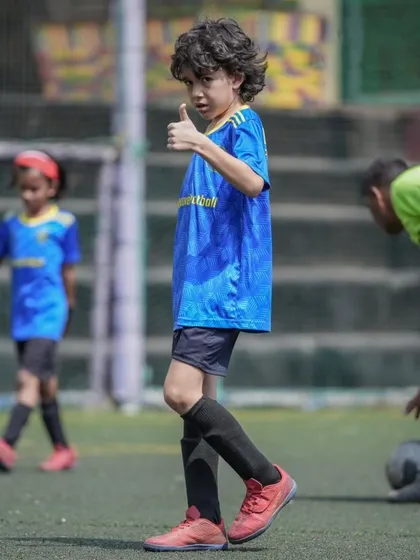 Ready to own the week, one kick at a time. A player gives a thumbs-up during training.