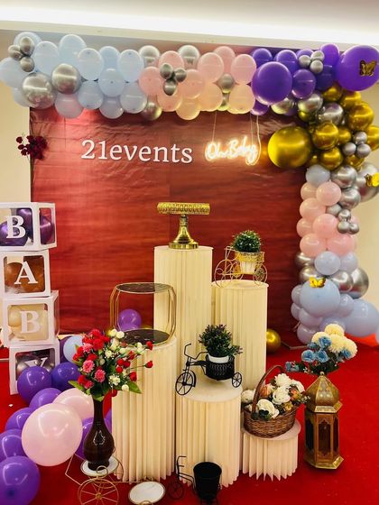 Another view of the purple and silver 'Oh Baby' shower decor.