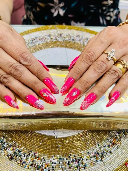 A vibrant hot pink set with silver glitter and large stone accents for a glamorous, party-ready look.