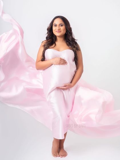The full effect of the flowing pink drape. It adds a sense of drama and elegance, turning a simple portrait into a work of art.