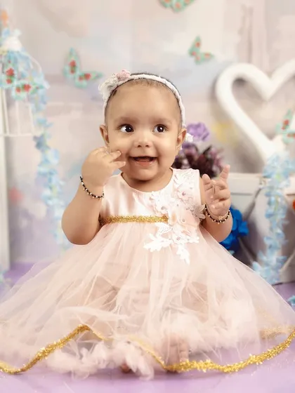 A sweet smile from this little princess. This half-birthday milestone shoot is a great way to capture the mid-point of that first amazing year.