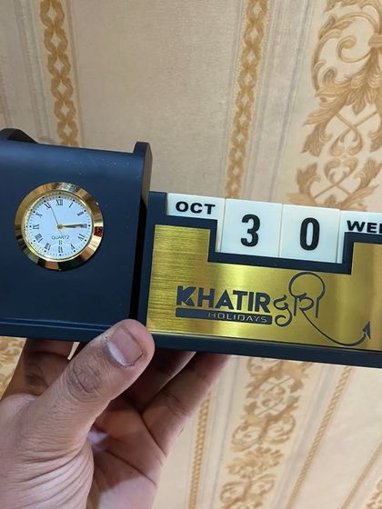 I can also customize these desk organizers with a company logo, as shown with this "Khatir Holidays" piece. It's a great way to create branded welcome kits or corporate gifts that stay on your client's desk year-round.