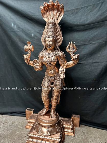A classical South Indian bronze icon of Mahamariamman. The standing posture and the details of her attire are typical of traditional temple idols we create for clients worldwide.