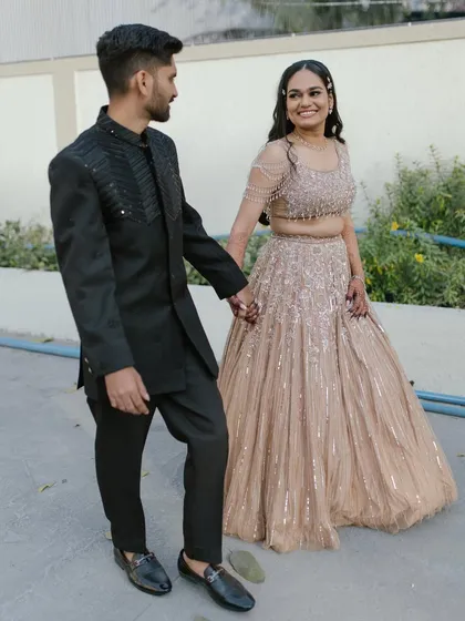 A beautiful candid shot of the couple at their engagement. Her makeup is soft and romantic, designed to look stunning both in person and in photos.