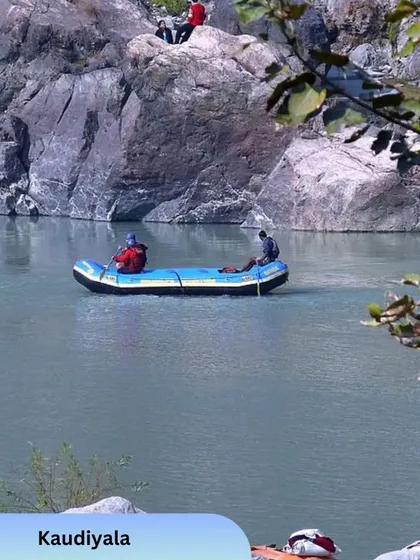 Here's a glimpse of the excitement on our white water rafting trips in Rishikesh. This shot captures a moment of calm on the river, surrounded by the rugged beauty of the landscape. We guide you through both the thrilling rapids and the serene stretches.