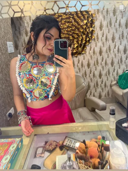 Getting ready for Navratri in a vibrant mirror-work blouse. This selfie captures the intricate details and festive spirit of the outfit.