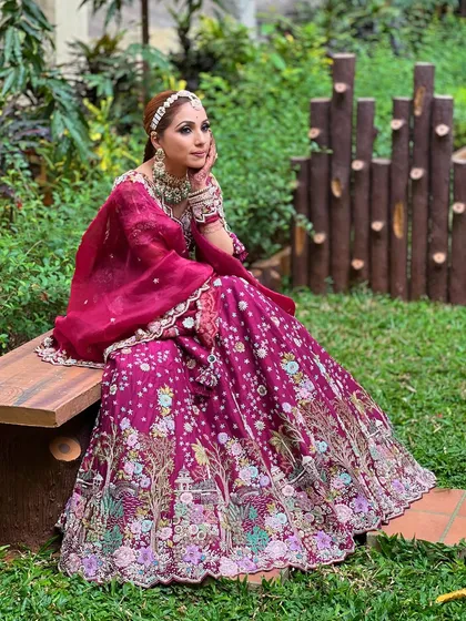 A thoughtful pose that highlights the entire look, from the jewellery to the flowing lehenga.