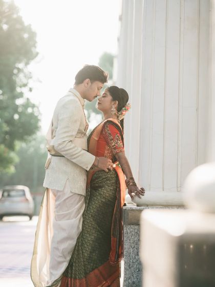 An intimate portrait of the couple against the backdrop of their wedding venue's architecture.