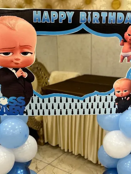 A close-up of a Boss Baby themed photo booth frame. These props are great for adding extra fun to the party.