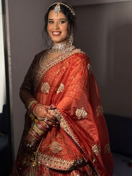 The happy smile of a bride ready for her wedding. The makeup is set to last through all the emotions and celebrations of the day.