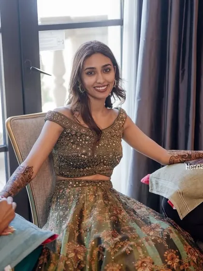 A smiling bride getting her mehendi done. The anticipation and excitement are my favorite parts of the job.