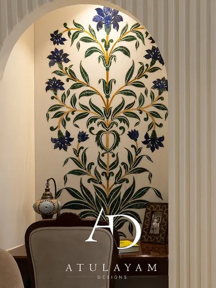 A stunning handmade stone inlay artwork serves as the focal point for the study nook, which is seamlessly integrated into the bedroom through an archway.