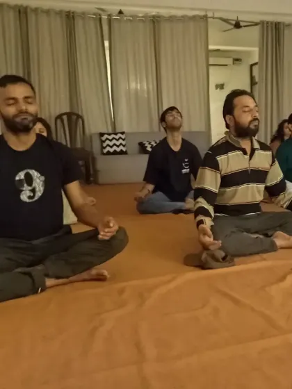 Seekers absorbed in meditation. The collective energy of the group practicing together creates a powerful atmosphere for going inward.