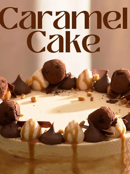 A close-up of the top of my Caramel Cake, showing the delicious assortment of chocolate truffles, piped meringue, and caramel drizzle.