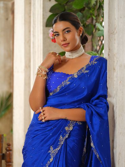 This cluster is a tribute to the saree in all its forms. It includes traditional weaves, modern pre-draped styles, and sarees paired with unique blouses, showcasing the endless possibilities for styling this iconic Indian garment.