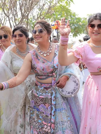 The bride's squad, dressed in beautiful pastels, dancing and enjoying the baraat procession. We love their coordinated energy.