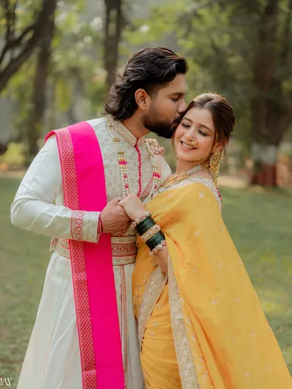 A tender moment from a traditional Marathi pre-wedding shoot. We focus on capturing the quiet connection between a couple, highlighting the richness of their heritage attire, like the groom's classic sherwani and the bride's vibrant yellow nauvari saree.
