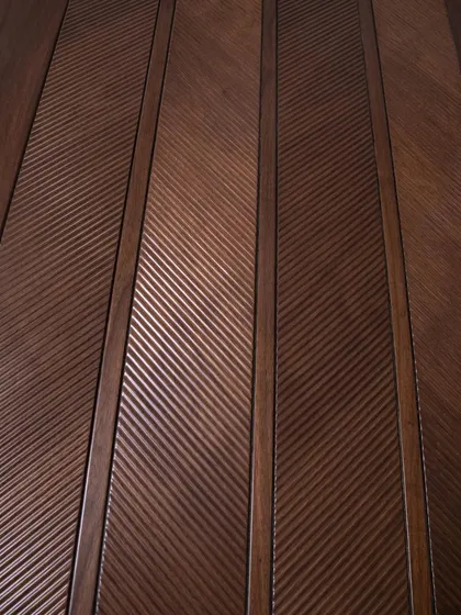 An angled shot of the chevron-patterned door, highlighting the depth and precision of the ripped flute texture. This is a design that truly engages the senses.