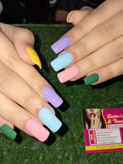 A fun and colorful set with each nail painted a different pastel shade. Perfect for a vibrant, playful look.