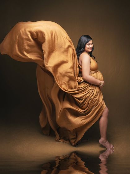 Your journey deserves to be captured in the most breathtaking way. This portrait in a flowing golden gown is art that speaks to the soul.