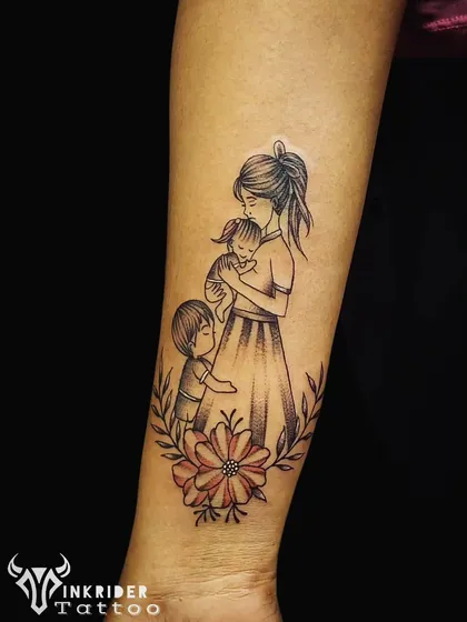 Some stories are best told with delicate lines. We created this heartfelt family tattoo to capture the eternal bond between a mother and her children. It’s a piece that celebrates love and connection, designed to be a timeless tribute.