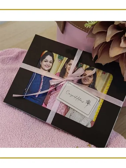 A personalized photo frame included in a 'Bride-to-be' hamper, capturing a special moment. It's a thoughtful touch that makes the gift truly personal.