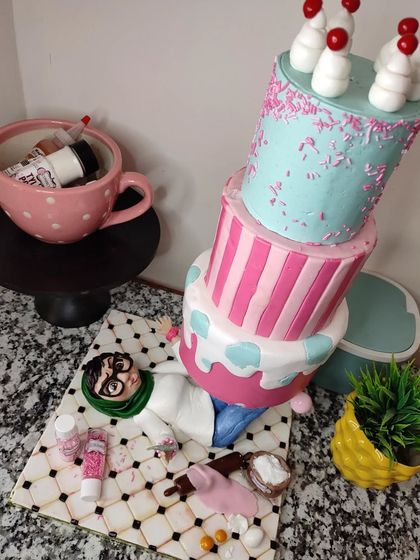 A cake that captures the chaotic life of a baker! This gravity-defying, topsy-turvy cake was made for a bakery brand, featuring a caricature of me crushed underneath. All the little baking ingredients scattered around are also completely edible.