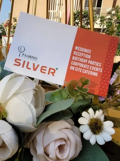 Our branding for Paariso Caterers Silver, a premium service for weddings, receptions, corporate events, and on-site catering. This signifies our range of service tiers.